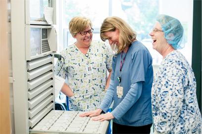 picture of our AMGH Pharmacy filling the Omnicell and nurse is assisting